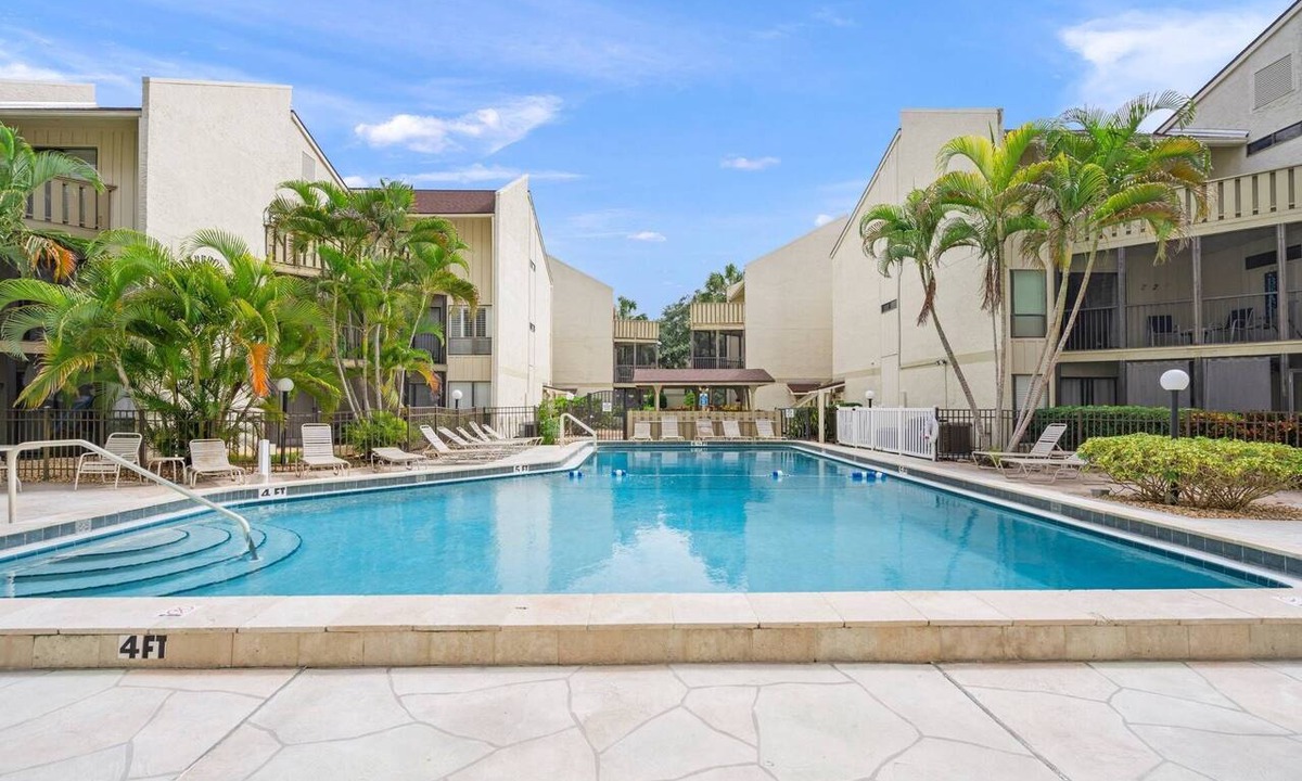 Siesta Key Condo | Bayfront Balconies in Tropical Siesta Key with Sunrise Views & Walkable Beach Access