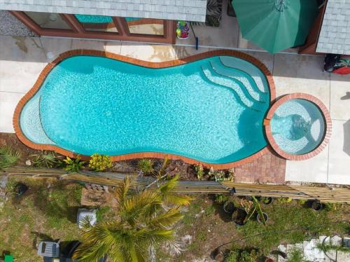 Sarasota Springs Villa | Dog Friendly Tropical Villa, Heated Salt Pool