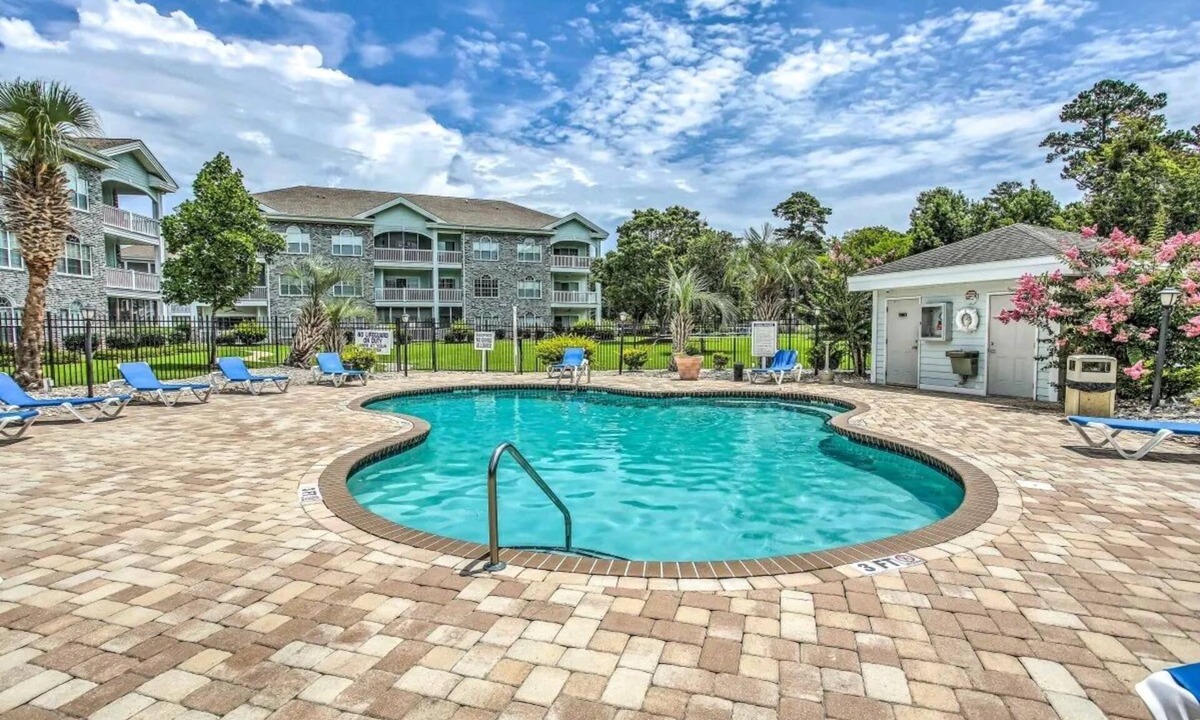 Central Myrtle Beach Condo | Endless Summer Coastal Condo at Magnolia Place - Pool & Golf Course Views!