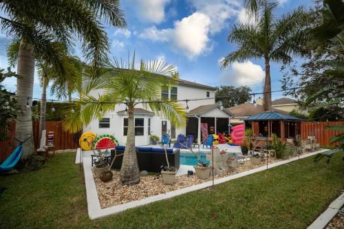 Tropic House | Gorgeous Urban Oasis withHot Tub, HEATED POOL and Private Movie Theater home