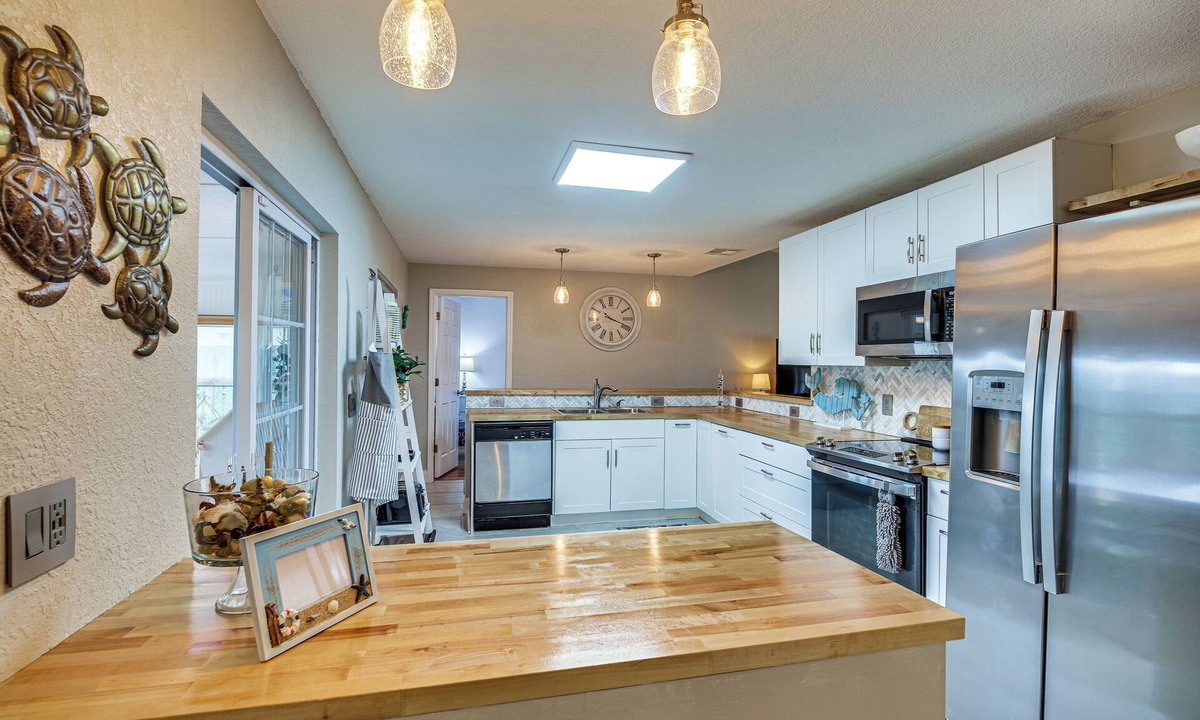 Surfside Estates Cottage | Lovely Merritt Island Home w/Kayak + Fire Pit!