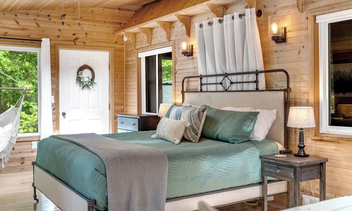 Evart Cottage | Quiet, private and wooded waterfront on a huge lot. King beds. Boats included!