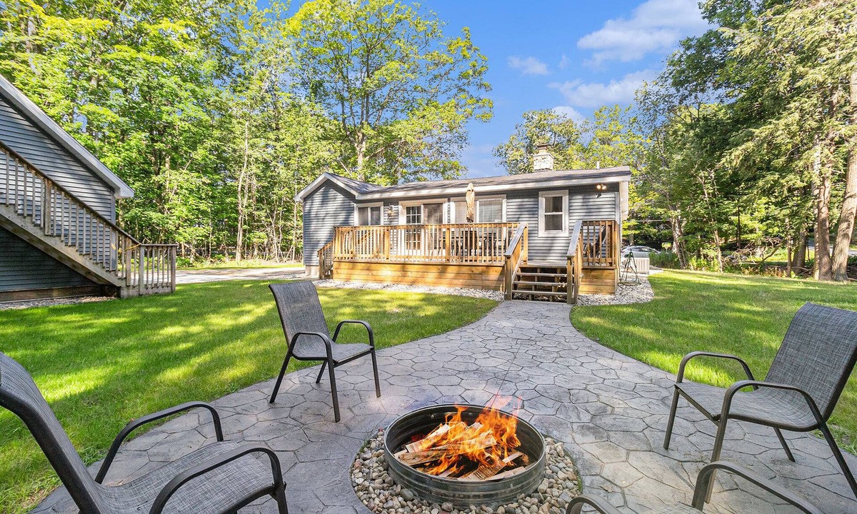 Manistee Cottage | Remodeled Home Near Lake MI, Fire Pit