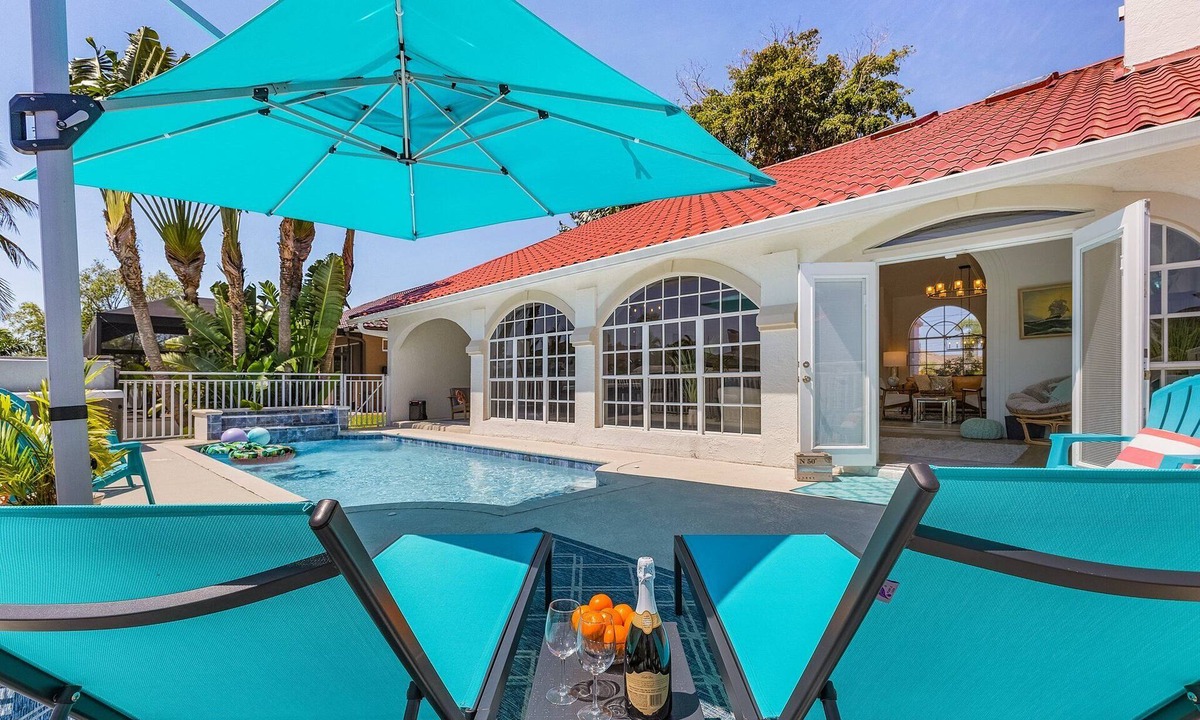Pelican Villa | Sophisticated 3 BR waterfront Villa with heated pool, hot tub, kayaks, dock and tiki hut