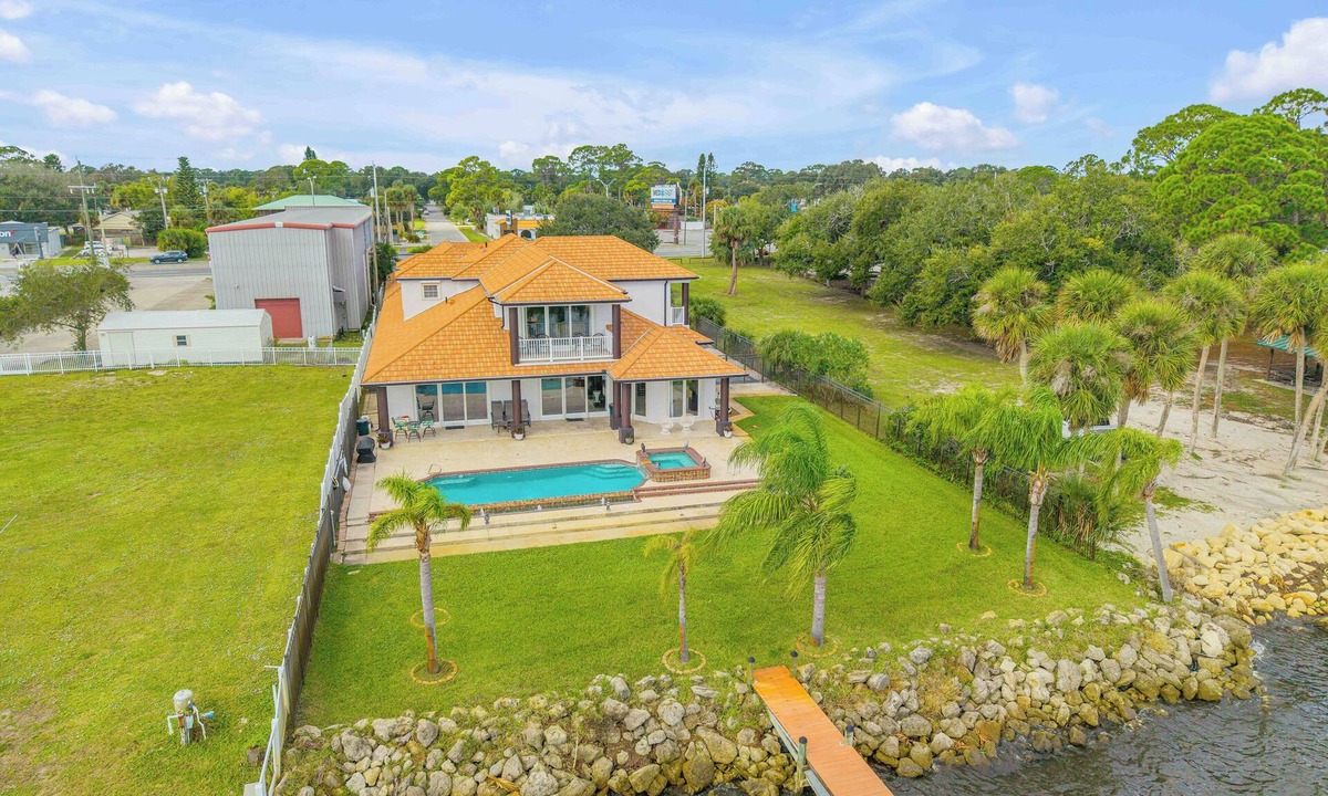 Titusville House | Space Coast Luxury Estate with Heated Infinity Pool, Hot Tub & Fitness Center