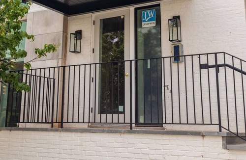 Old Town Alexandria Apartment | A rare find: sun-drenched 2BR corner suite in an 1860 furniture factory turned Art Deco landmark. Bold art, King Street views, boutique-hotel design. Chef's kitchen, in-unit laundry. Steps to Old Town's waterfront. Dogs welcome.