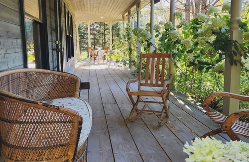 Mandeville Ski Chalet | A small, rustic cabin surrounded by trees, with access to an alpaca farm!