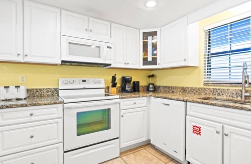 Avon By The Sea Condo | Beautiful ground floor condo. Steps to the heated pool, BBQ grills, and beach! ☀️
