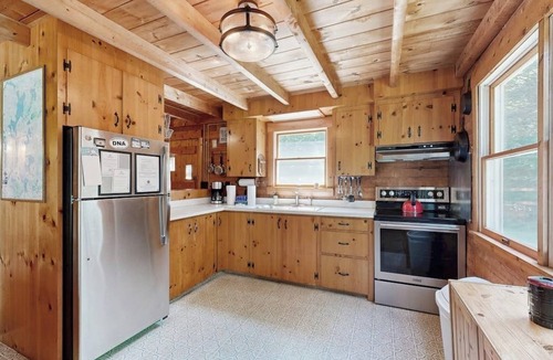 Beaver Cove Cabin | Beautiful home with WiFi, lake view, deck, & firepit - walk to beach