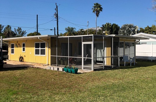 Longbeach Village Cottage | Canal front cottage, walking distance to sandy Gulf