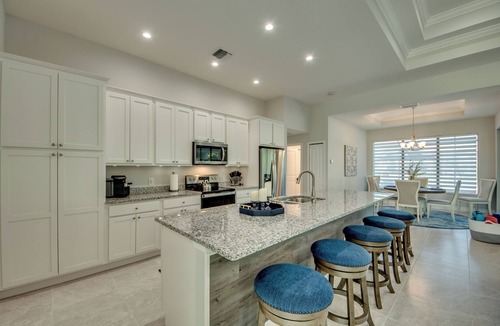 Pelican Villa | Cape Paradise - Magnificent 4 BR Villa with heated saltwater pool, kayaks, bikes, and fishing poles