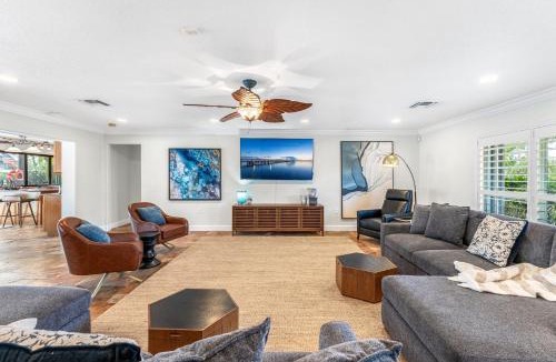 Cocoa Isles Villa | Casa De Olas - Waterfront Luxe Home - Heated Pool - Game Room - Boat Lift - Minutes to Beach
