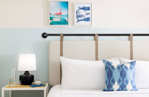 New Town Hotel | Colorful Stay at Blue Flamingo | Poolside Bar, Lawn Games, Music & Fire Pits