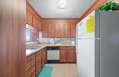 Crescent Beach Condo | Cozy oceanfront condo, rustic wood paneling and fully equipped kitchen | Sun Villas - A-2