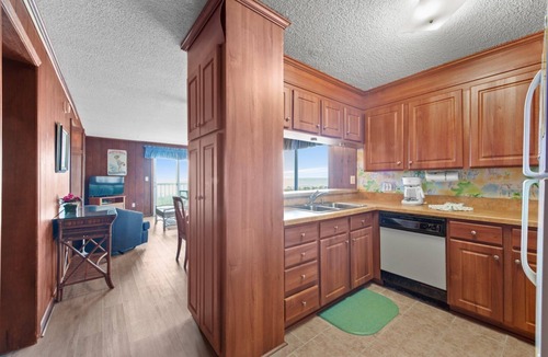 Crescent Beach Condo | Cozy oceanfront condo, rustic wood paneling and fully equipped kitchen | Sun Villas - A-2