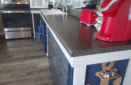 Surf City Cottage | Deep-Water Canal Front Coastal Cottage Only Steps to the Beach & Pet Friendly!