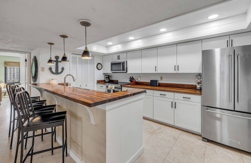 Ormond-by-the-Sea Condo | Direct oceanfront corner condo with big balcony, heated beachfront pool and garage parking