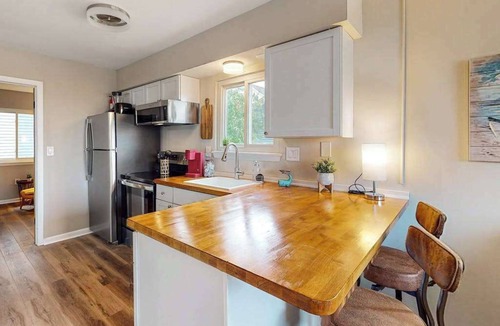 Caine Woods Condo | Dog-friendly condo near beach with updated interior & private W/D