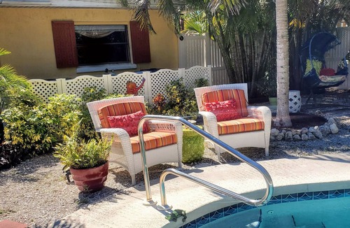Palm Island House | Enchanted Private Island Oasis Steps To Beach, Tropical Yard & Charm Filled Home
