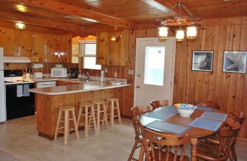 Holden Beach Cottage | Experience oceanfront bliss at The Lee Cottage in Holden Beach, NC, perfect for 6 guests.