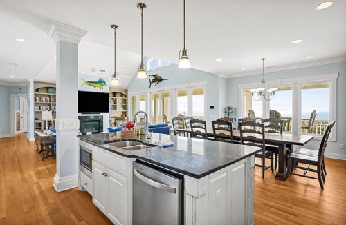 Caswell Beach House | Experience oceanfront luxury at 'Our American Dream' in Oak Island, NC, perfect for 19 guests!