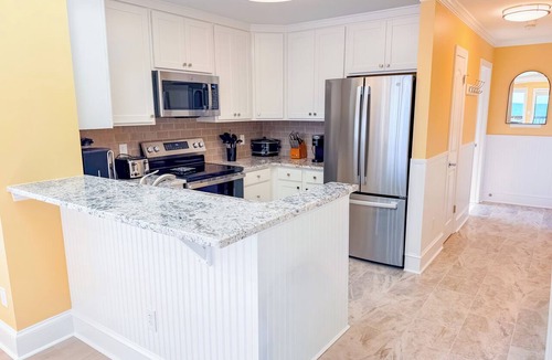 Ocean Drive Condo | Experience Tilghman Beach and Racquet Club Unit 301! Oceanfront, Pools, Tennis, Close to Main Street!