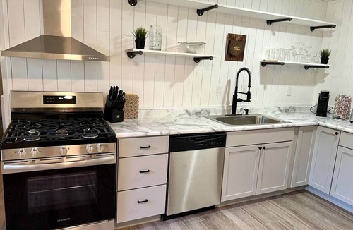 Royal Manor House | Family & Fur Friendly: 4-BR, Arcade, Fire Pit, Fenced, King Bed, & Smart TV!