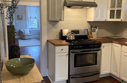 Elkridge House | Four bedrooms, porch and parking! Pet-friendly with a large fenced yard.