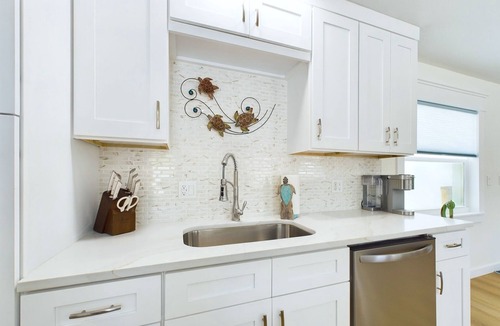 Surfside Estates House | Island Oasis with Heated Pool, Putt Putt Course, Tiki Bar, and Beach Gear!