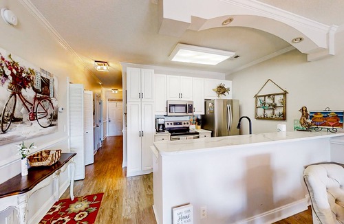 Carolina Yacht Landing Condo | Lakefront condo with private balcony, pool, close to beach
