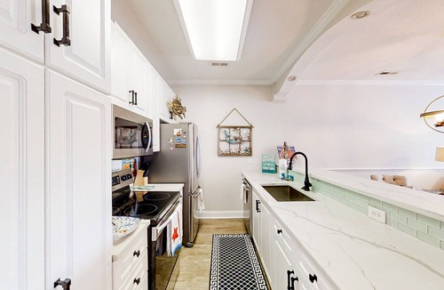Carolina Yacht Landing Condo | Lakefront condo with private balcony, pool, close to beach