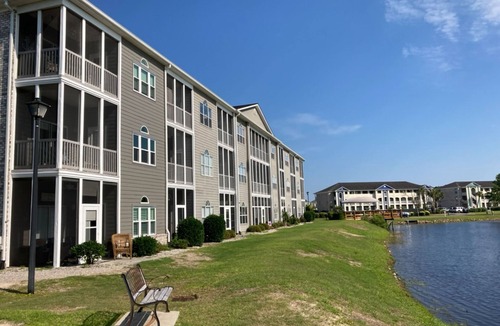 Carolina Yacht Landing Condo | Lakefront condo with private balcony, pool, close to beach