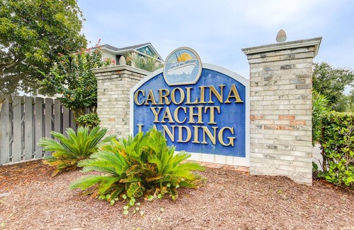 Carolina Yacht Landing Condo | Lakefront condo with private balcony, pool, close to beach