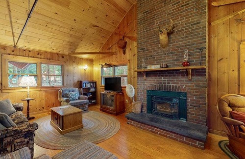 Greenville Junction House | Lakefront Home with Private Dock, Pebble Beach & Enclosed Porch - Dogs Welcome