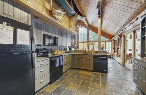 Greenville Junction House | Lakeside Lodge with Amazing Water Views, Screened Porch, Dock, & Firepit