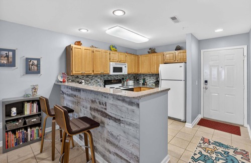 Rehoboth Beach Condo | Linens Coastal Ground Level Condo Sleeps 5 Pools Parking EV Charger