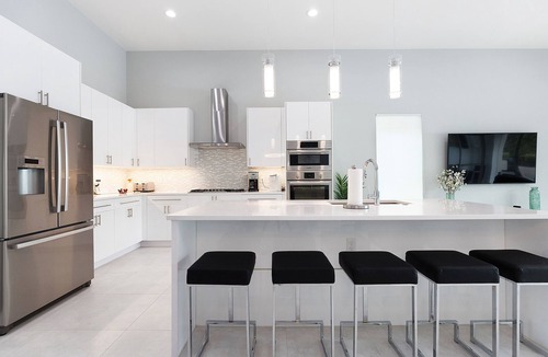 Reunion Villa | Modern Luxury Villa | 5BR, 5 Bath Luxe Home w/Private Pool, Arcade, and Theater Near Disney