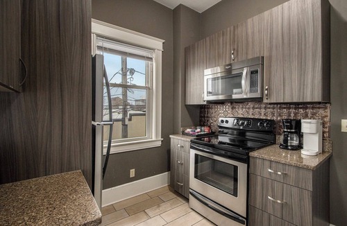 Central Business District Apartment | NEW Charming 2nd Floor Victorian Flat in Downtown Kalamazoo
