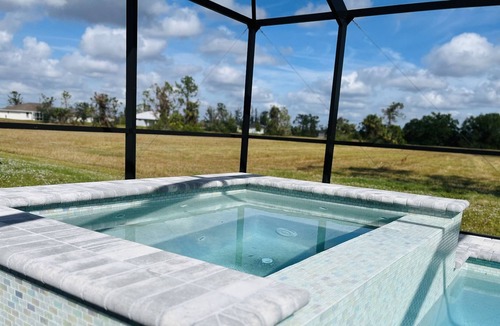 Jacarandas House | New heated pool/spa overlooking natural florida preserve.