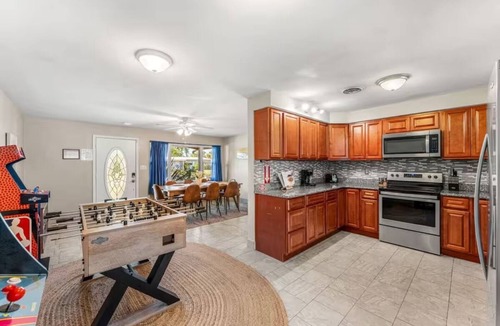 Cocoa Isles House | Private Pool + Hot Tub + Outdoor Movie Nights — Relax in your own backyard oasis with a heated pool, spa, fire pit, and fire up the projector under the stars. Located in famous Cocoa Beach near Kennedy Space Center, Disney & Port Canaveral!