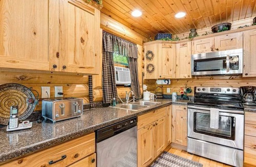 Lyndon Station House | Riverfront cabin with a dock, kayaks and a canoe - firepit and water views