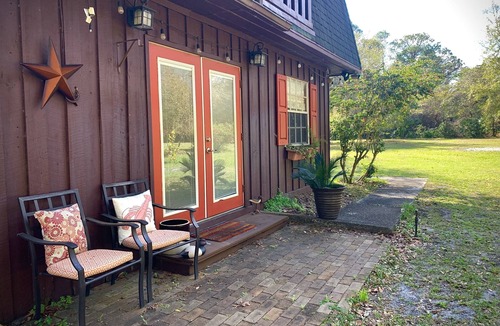 Scottsmoor Cottage | Rocket & Nature Lovers! Vintage European Cottage in a lush Florida Setting