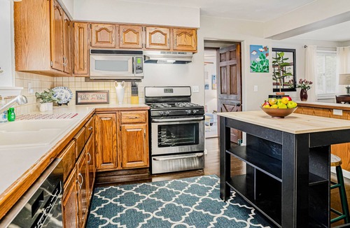 Fennville Cottage | Secluded & cute cottage near Pier Cove Beach with deck, firepit, grill, lawn, AC