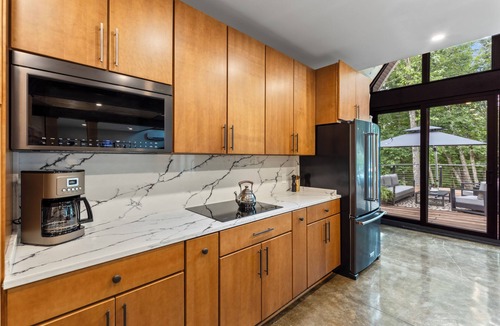 Blue Eye House | Secluded Modern Home on 9 Wooded Acres with Indoor Pickleball Court