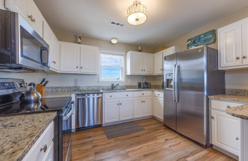 Ocean Isle Estates House | Semi-Oceanfront Home in Avon with Hot Tub, Smart TVs, and Basketball Hoop