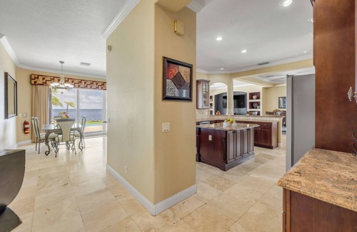 Titusville House | Space Coast Luxury Estate with Heated Infinity Pool, Hot Tub & Fitness Center