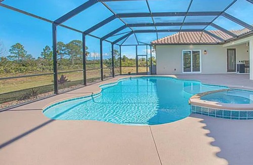 Grant-Valkaria Villa | Stunning Mediterranean-style estate with spillover hot tub/pool! Atlantic Oasis!