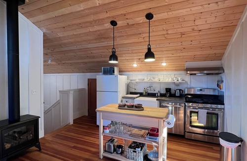 Shelter Cove Cottage | Stunning ocean view from the yard of this cozy home with balcony and fireplace