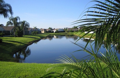 Sabal Harbour Villa | Stylish Lakefront Villa with South Facing Pool. A short drive to fine beaches.