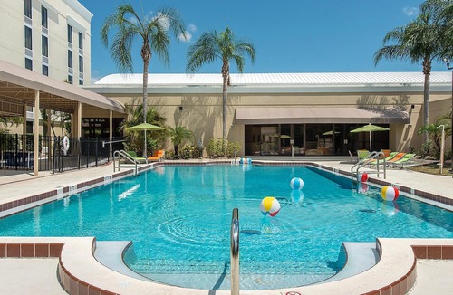 Tropic Hotel | Stylish Viera Stay | Outdoor Pool | Free Parking | Pets Welcome